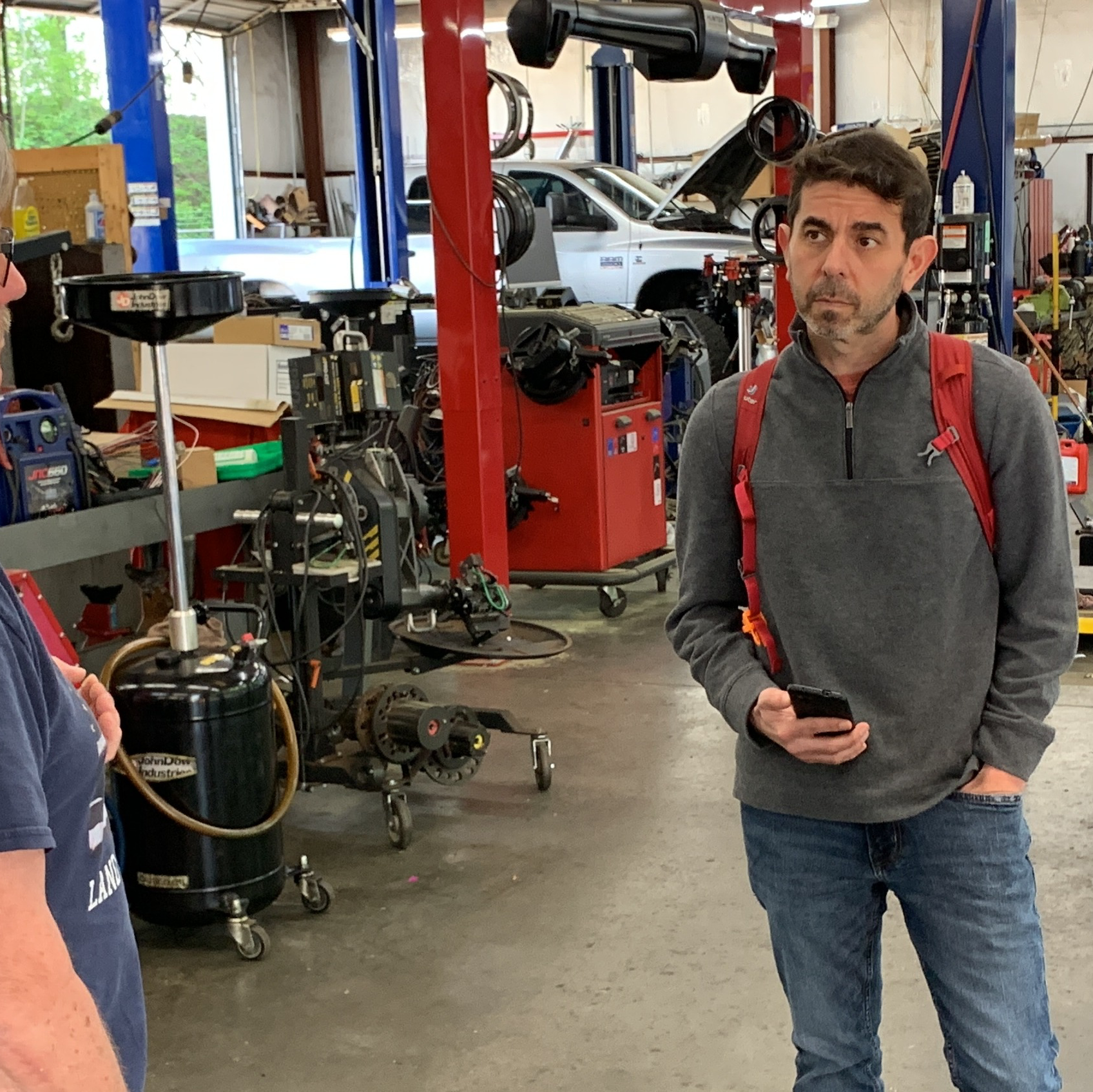 Matt Wallens doing field research at an auto repair shop